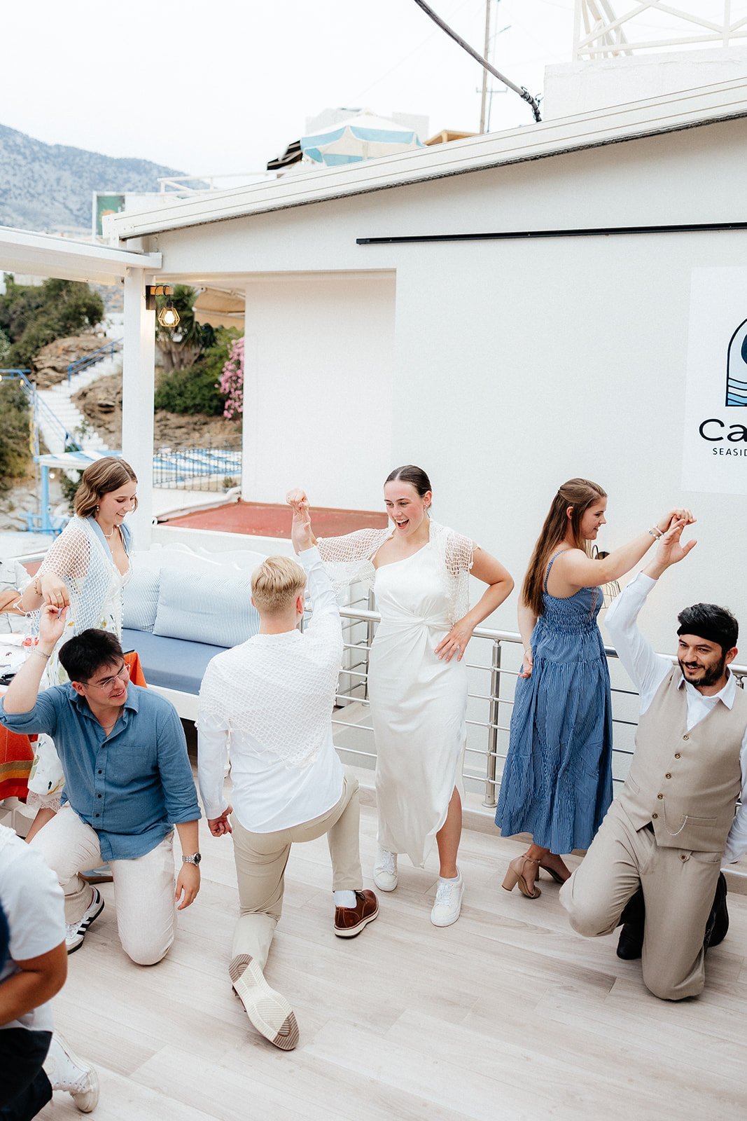 Destination Wedding Rehearsal Dinner Photos in Greece taken by Destination Wedding Photographer of couple in Crete Greece on the beach inspired by documentary style wedding photography and Greece wedding photos